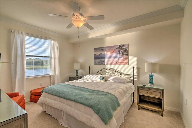 bedroom featuring light carpet, baseboards, ornamental molding, and a ceiling fan