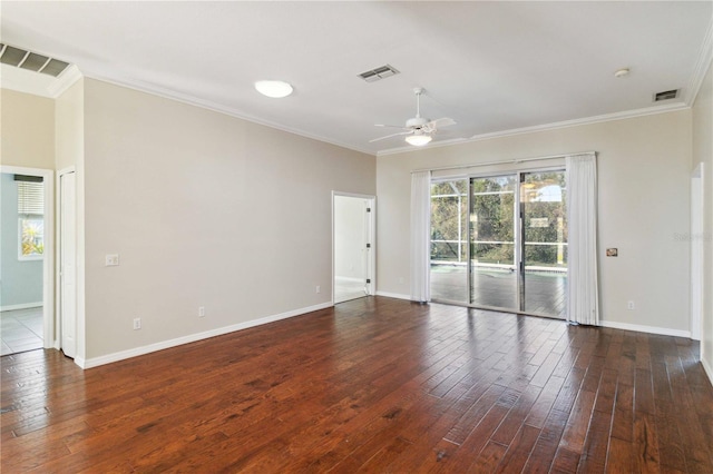 unfurnished room featuring wood-type flooring and visible vents