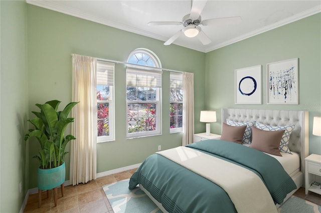 bedroom featuring a ceiling fan, tile patterned flooring, baseboards, and crown molding