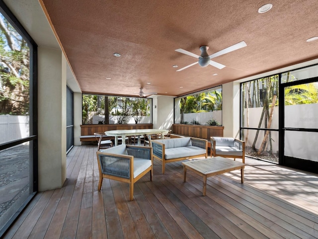 sunroom with a ceiling fan