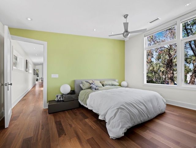 bedroom featuring recessed lighting, dark wood-type flooring, a ceiling fan, baseboards, and visible vents