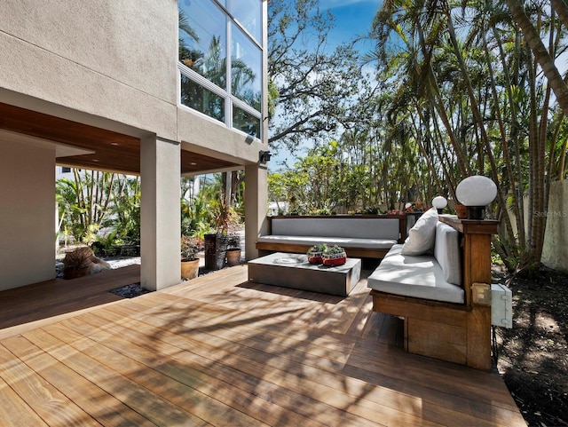 wooden deck with an outdoor hangout area