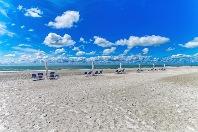 view of home's community featuring a view of the beach and a water view