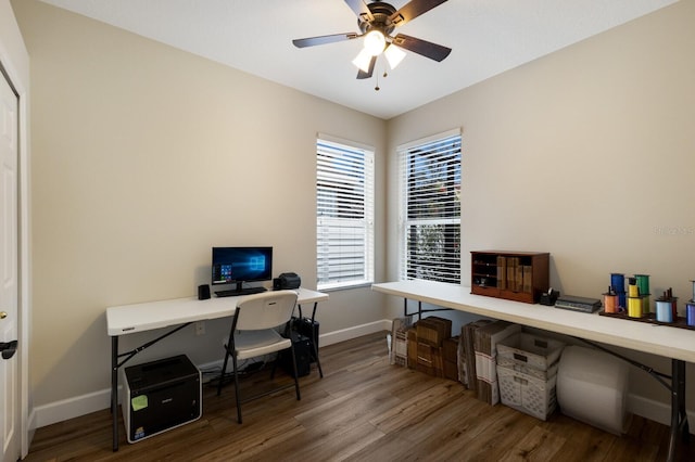 office area with ceiling fan, baseboards, and wood finished floors