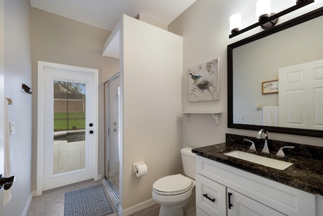 bathroom featuring baseboards, toilet, tile patterned flooring, vanity, and a shower stall