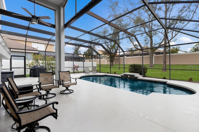 view of swimming pool with a lanai, fence, a grill, a fenced in pool, and a patio area