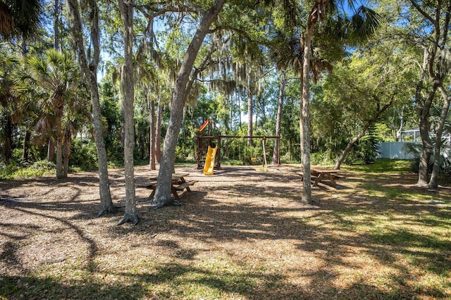 view of yard featuring playground community