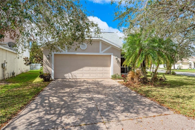 view of front of property featuring an attached garage, driveway, a front lawn, and stucco siding