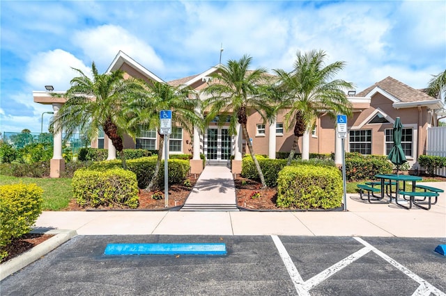 view of property with uncovered parking