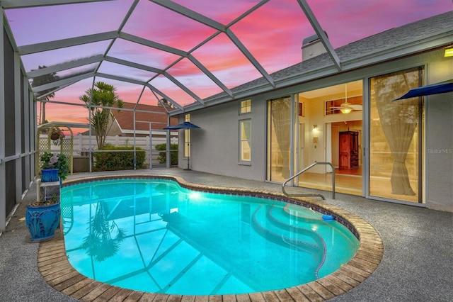 outdoor pool with a patio area and a lanai