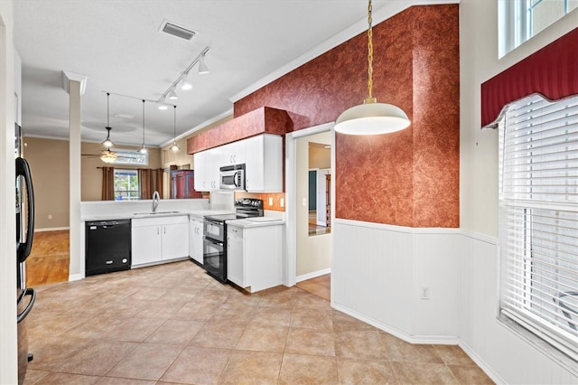 kitchen featuring range with two ovens, a sink, light countertops, dishwasher, and stainless steel microwave