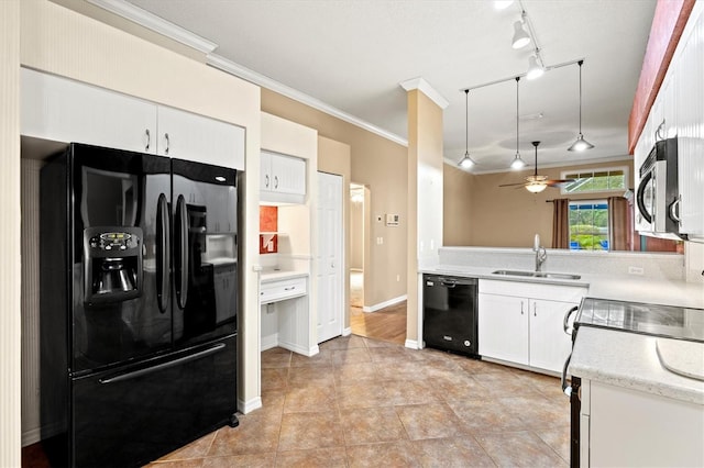 kitchen featuring a sink, black appliances, light countertops, and white cabinets