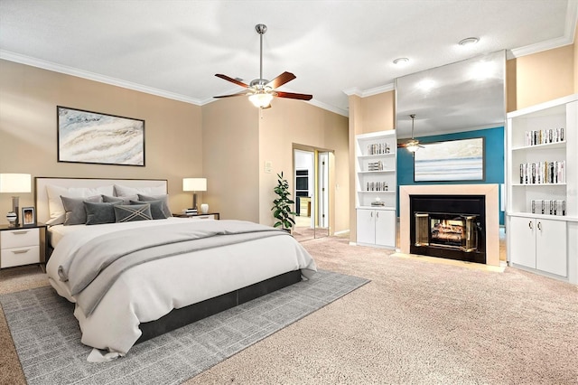 carpeted bedroom featuring ornamental molding, a multi sided fireplace, and a ceiling fan