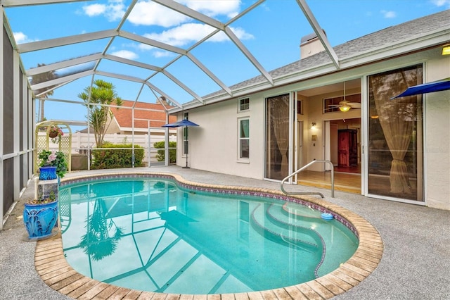 pool featuring a lanai and a patio area