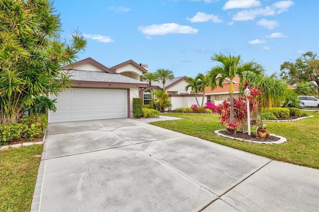 ranch-style home featuring a garage, driveway, a front lawn, and stucco siding