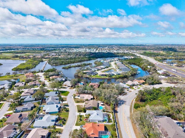 birds eye view of property featuring a water view and a residential view