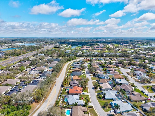 bird's eye view featuring a residential view and a water view