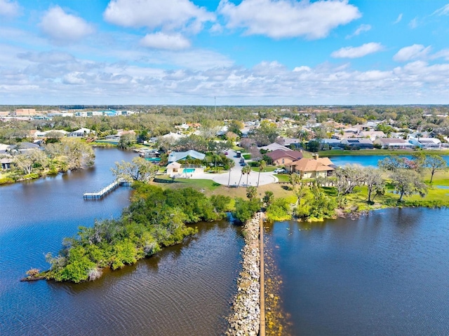 birds eye view of property with a water view and a residential view