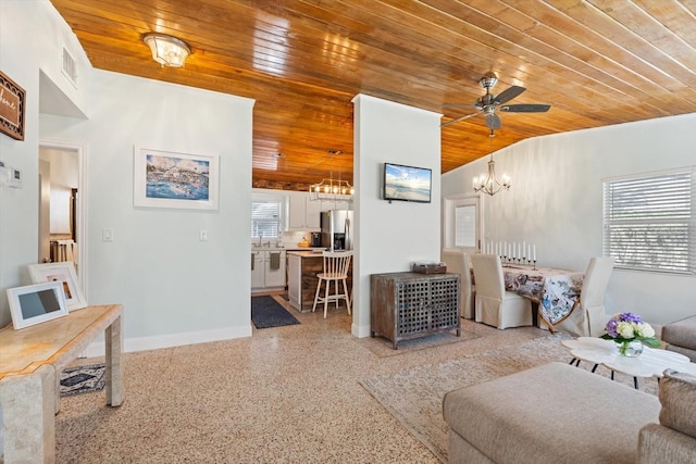 living room with light speckled floor, visible vents, wooden ceiling, and a wealth of natural light