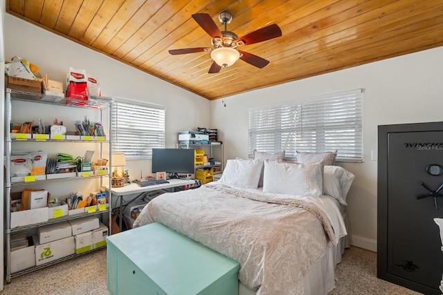 bedroom featuring lofted ceiling, wood ceiling, baseboards, and ceiling fan