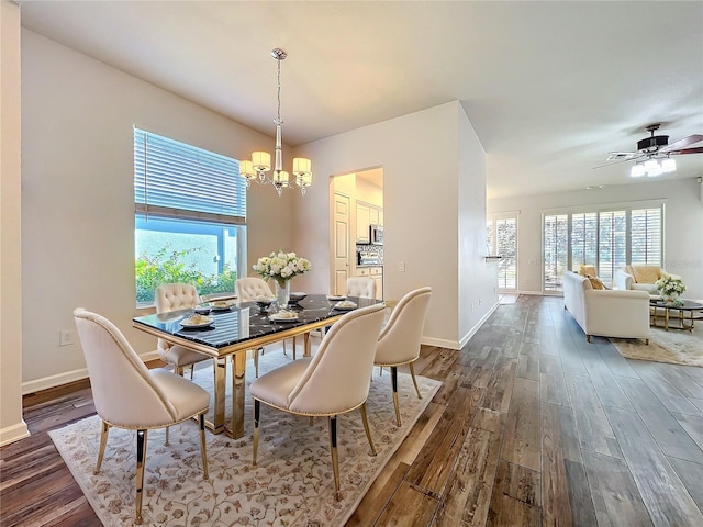 dining area featuring dark wood-style floors, plenty of natural light, and baseboards