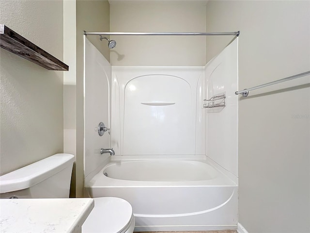 bathroom featuring toilet, bathtub / shower combination, and vanity