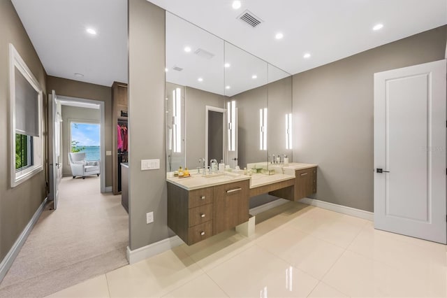 bathroom with vanity, visible vents, baseboards, recessed lighting, and tile patterned floors