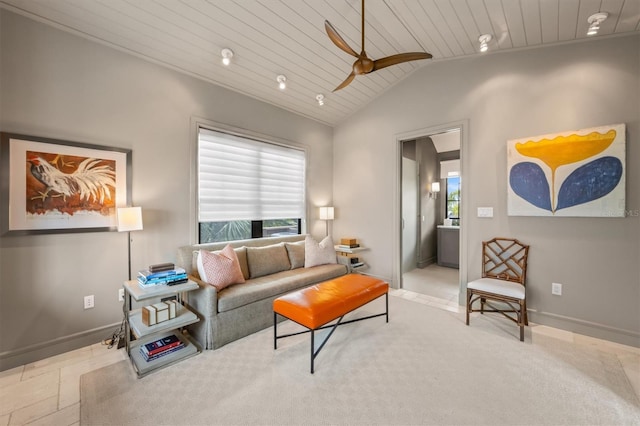 living area with a healthy amount of sunlight, wooden ceiling, baseboards, and lofted ceiling