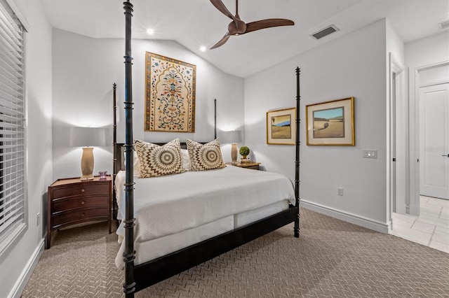 bedroom with carpet, lofted ceiling, baseboards, and visible vents