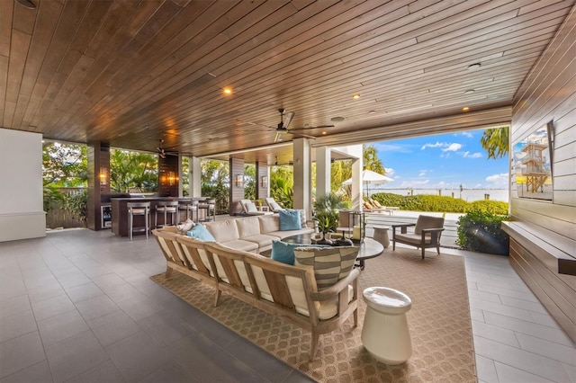 view of patio / terrace featuring outdoor dry bar, an outdoor hangout area, and ceiling fan