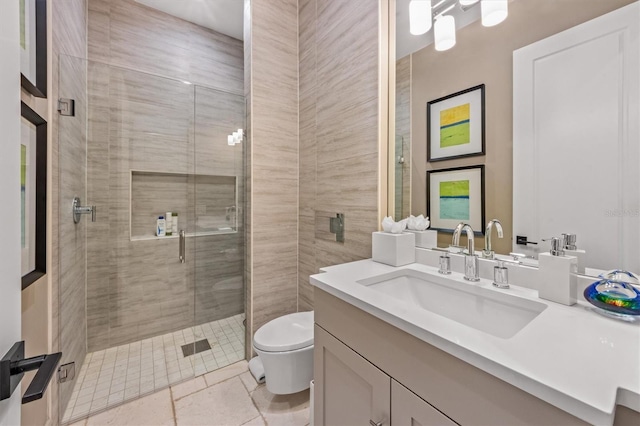 full bathroom featuring vanity, toilet, and a shower stall