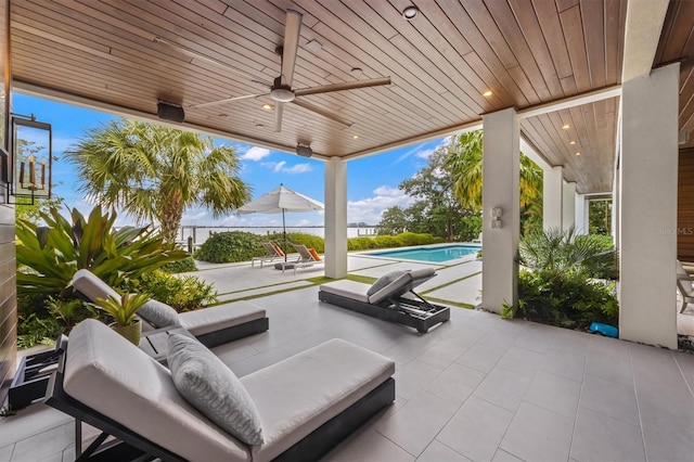 view of patio featuring an outdoor pool, an outdoor hangout area, and ceiling fan