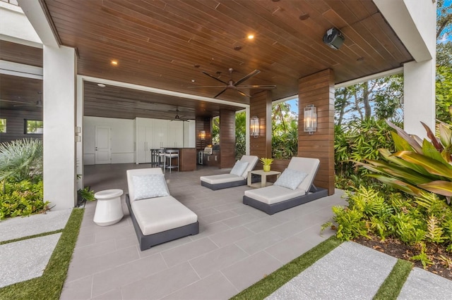 view of patio / terrace with outdoor dining space and a ceiling fan