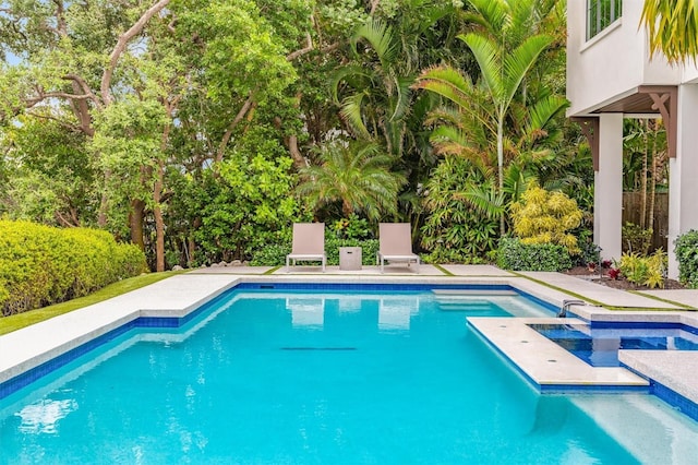 pool with an in ground hot tub