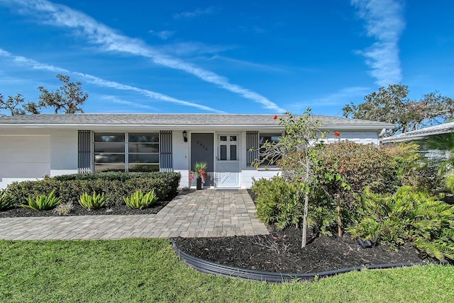 ranch-style house featuring an attached garage