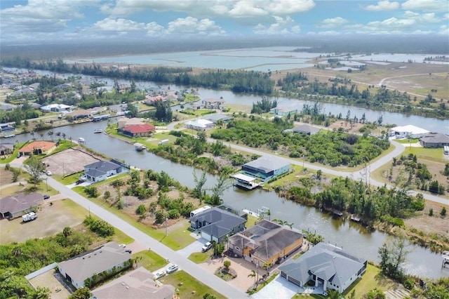 aerial view with a residential view and a water view