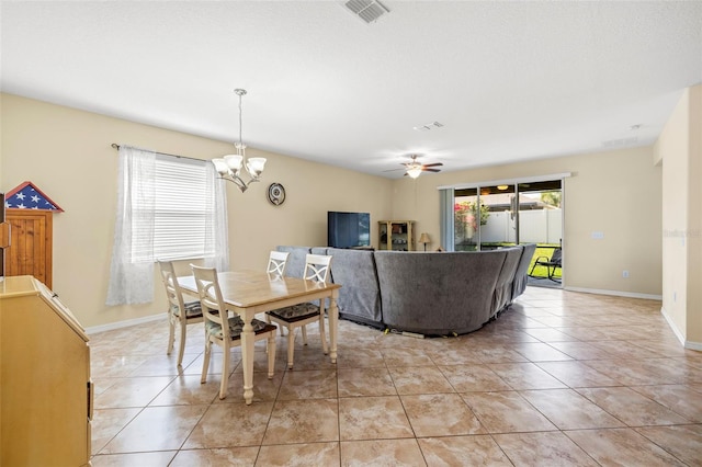 dining area with a healthy amount of sunlight, visible vents, baseboards, and light tile patterned floors