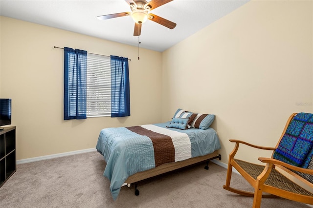 bedroom featuring carpet floors, baseboards, and a ceiling fan