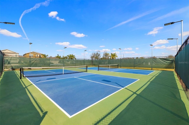 view of sport court with community basketball court and fence