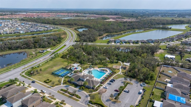 drone / aerial view with a water view and a residential view