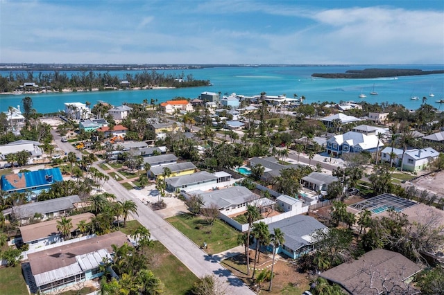 drone / aerial view with a residential view and a water view