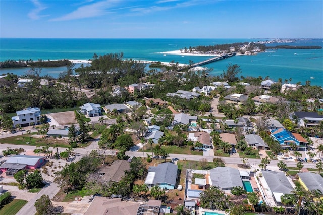 drone / aerial view featuring a water view and a residential view