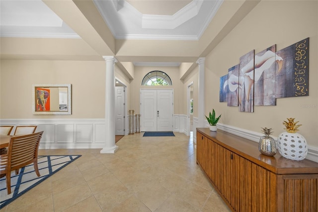 7108 Callander Cv, Lakewood Ranch, FL 34202 - foyer entrance with crown molding, decorative columns, and a decorative wall