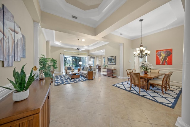 7108 Callander Cv, Lakewood Ranch, FL 34202 - dining area featuring light tile patterned floors, ornamental molding, a tray ceiling, ornate columns, and ceiling fan with notable chandelier