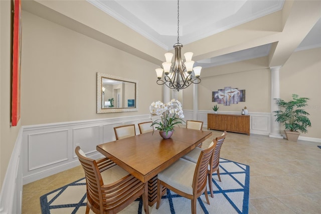 7108 Callander Cv, Lakewood Ranch, FL 34202 - dining area with ornamental molding, a tray ceiling, a decorative wall, and light tile patterned floors
