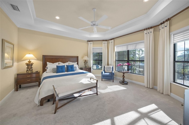 7108 Callander Cv, Lakewood Ranch, FL 34202 - bedroom with light carpet, a tray ceiling, multiple windows, and baseboards