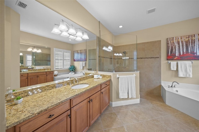7108 Callander Cv, Lakewood Ranch, FL 34202 - bathroom featuring a garden tub, tile patterned flooring, visible vents, and a walk in shower