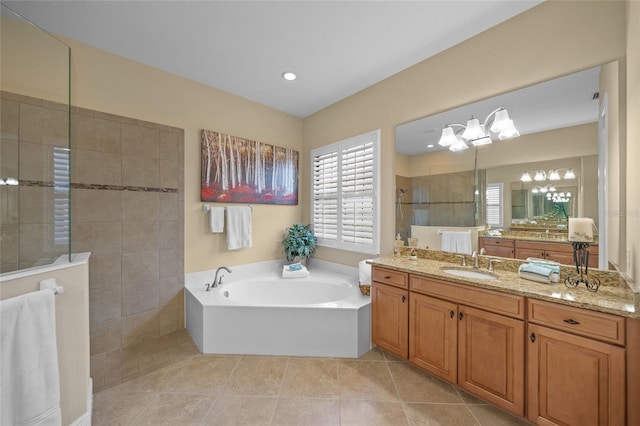 7108 Callander Cv, Lakewood Ranch, FL 34202 - full bath featuring tile patterned flooring, vanity, a bath, and a walk in shower