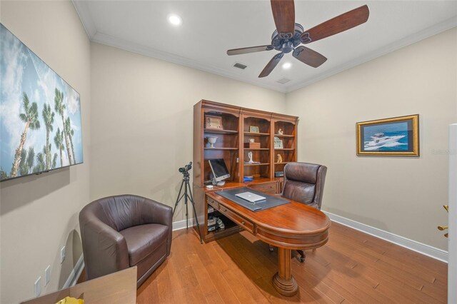 7108 Callander Cv, Lakewood Ranch, FL 34202 - office area featuring visible vents, baseboards, crown molding, and wood finished floors
