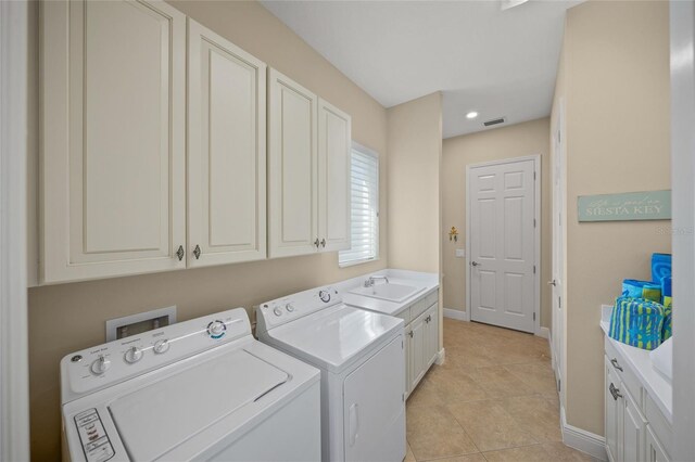 7108 Callander Cv, Lakewood Ranch, FL 34202 - clothes washing area featuring cabinet space, baseboards, separate washer and dryer, a sink, and light tile patterned flooring